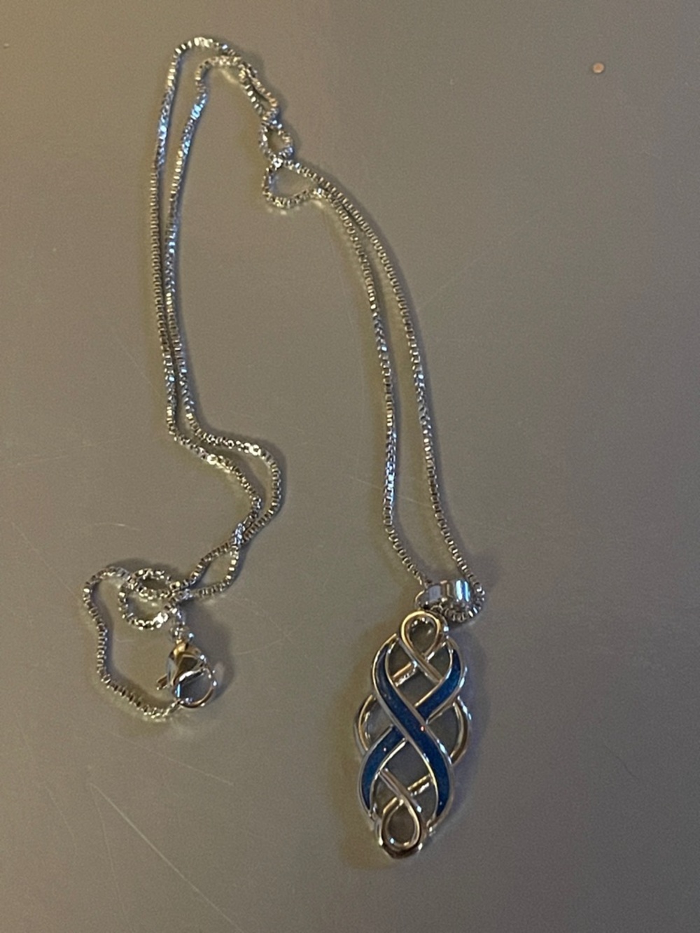 Silver and blue infinity necklace